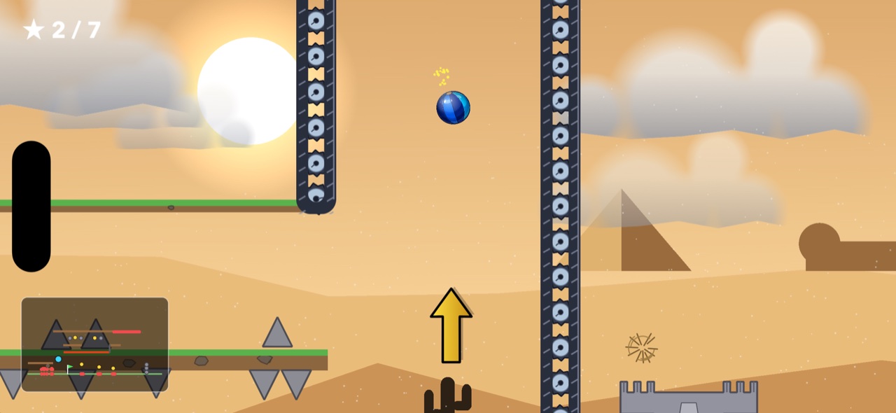 Desert level — conveyor walls, pyramid, and a directional arrow